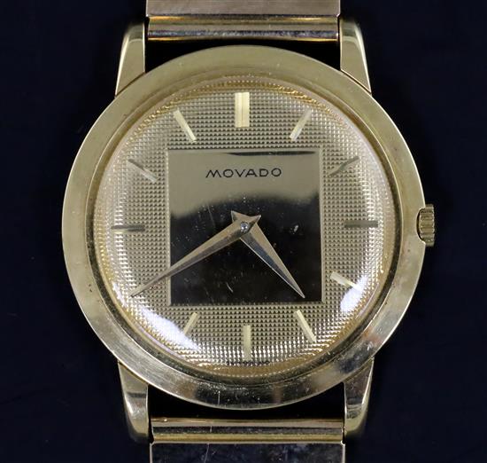 A gentlemans 18ct gold Movado manual wind wrist watch, on an associated 9ct gold brick link bracelet,